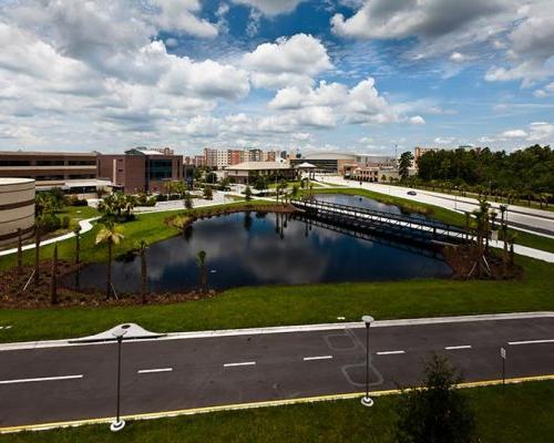 Stormwater retention basin adjacent to parking garage